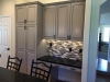 Oak cabinets painted Amazing Gray with van dyke brown glaze