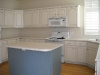White oak cabinets with pioneer blue island and beadboard